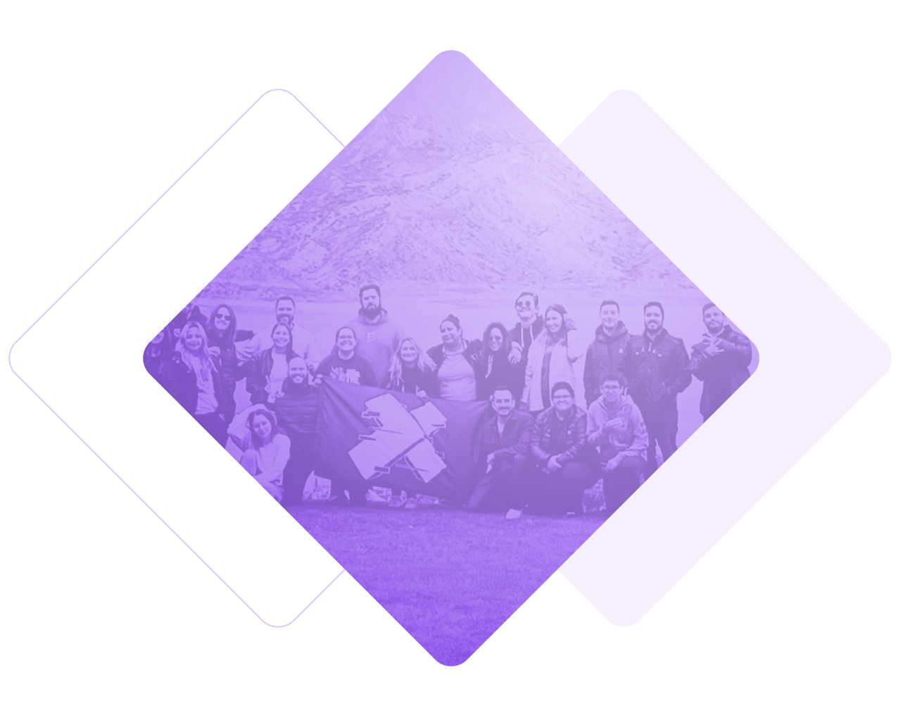 Image of X-Teamers at a team retreat. They are holding a flag with the X-Team logo.